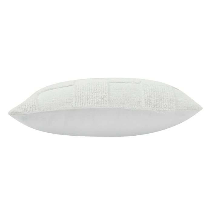 Side profile view of the plush Piper knitted checkerboard pillow showcasing its textured front and smooth fabric backing.
