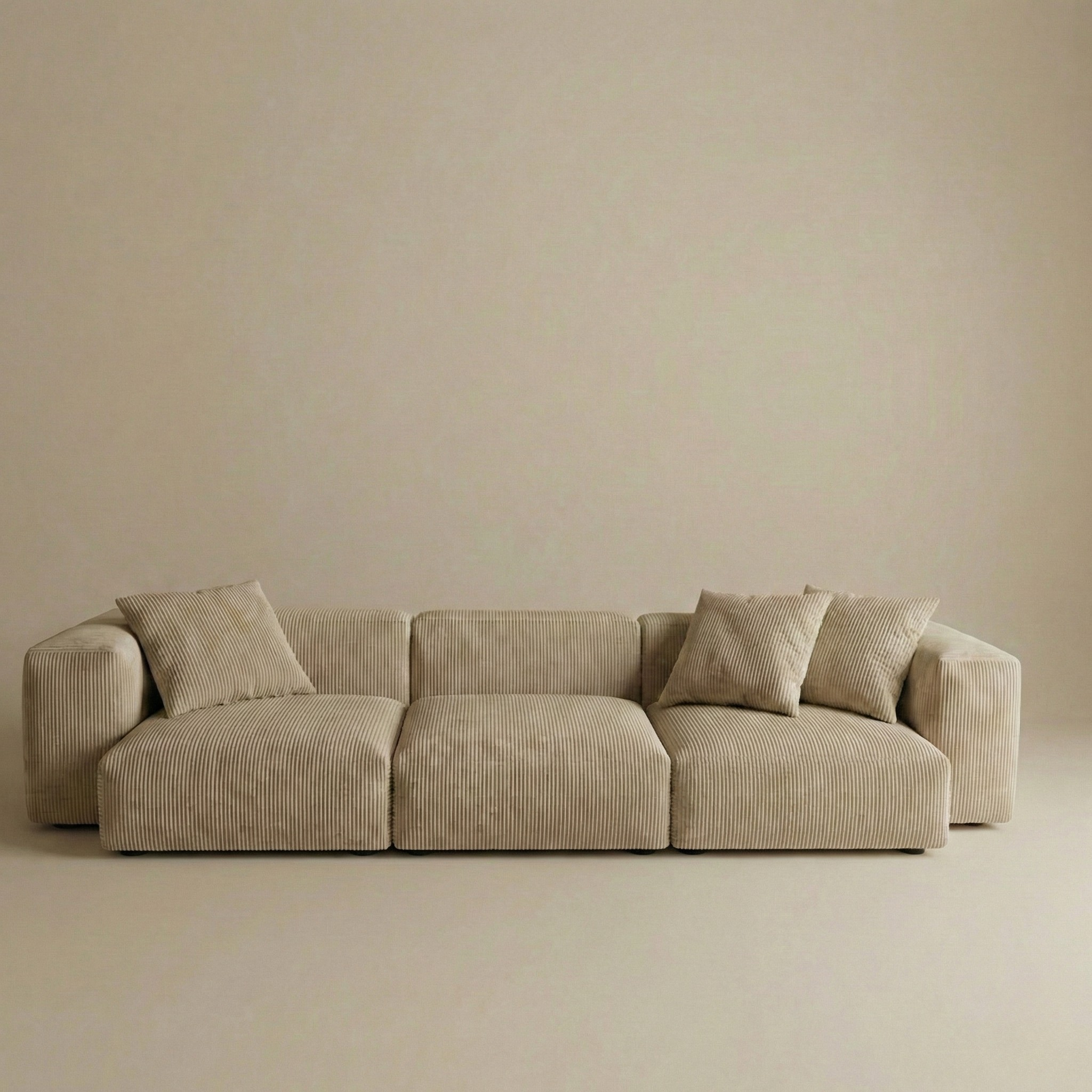 Beige sectional sofa against a beige wall
