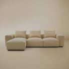 Sectional with ottoman Beige plush corduroy modular sofa in a studio background