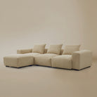 Angle view of the beige plush corduroy sectional with ottoman sofa in a studio background