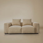Front view of the two seater plush corduroy modular sofa in a studio background
