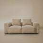 Front view of the two seater plush corduroy modular sofa in a studio background