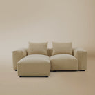 Two seater with ottoman plush corduroy modular sofa in a studio background