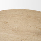 Close-up of the natural pores, markings, and tonal variation in the Romina travertine tabletop
