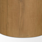 Close-up of the natural grain and warm brown finish on the Romina solid oak pedestal