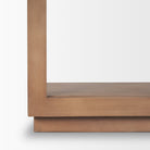 Close-up of the sturdy, layered wooden base and bottom shelf on the Rowan arched bookcase.