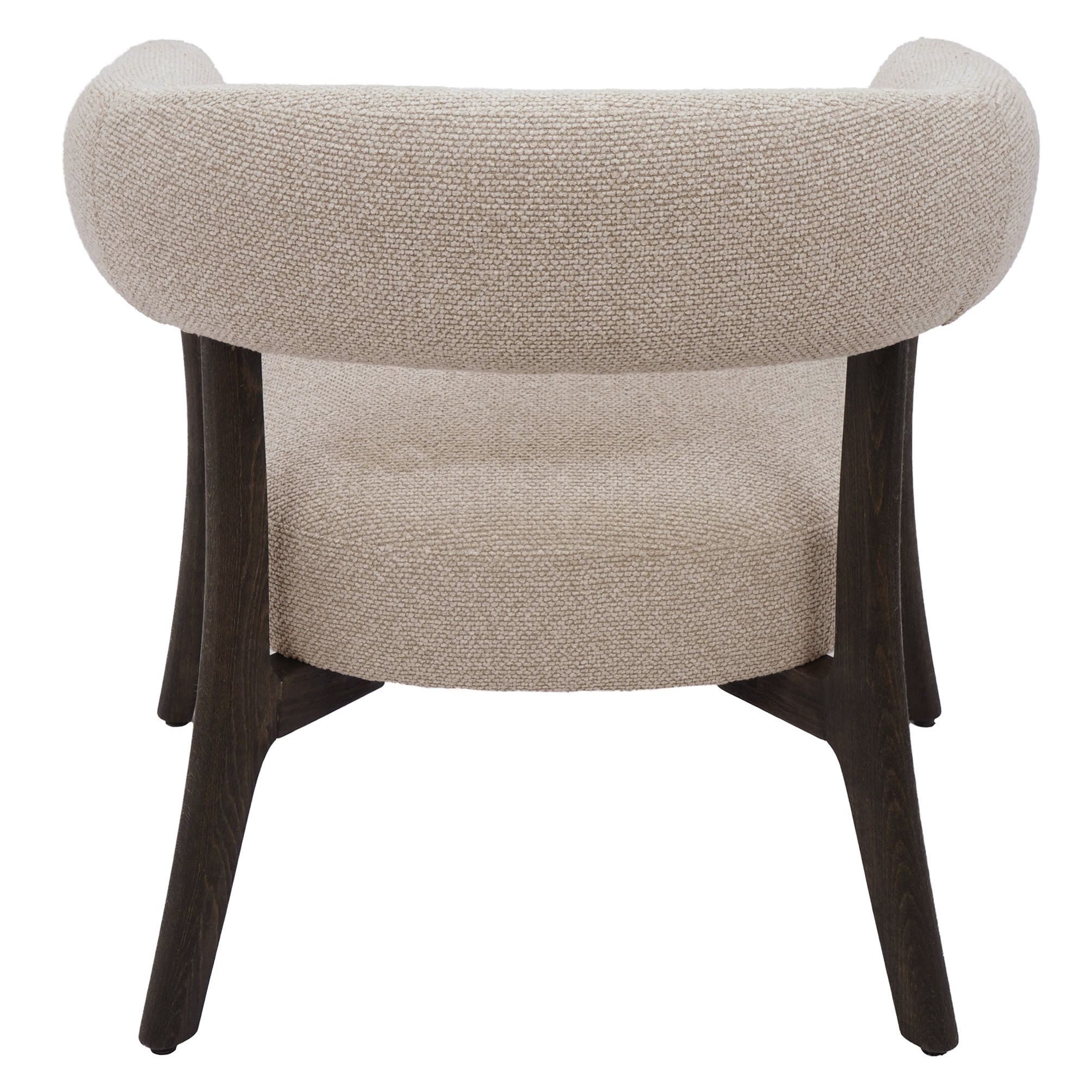 Rear studio view of the Rowan accent chair showcasing the continuous curve of the backrest and architectural dark wood base.
