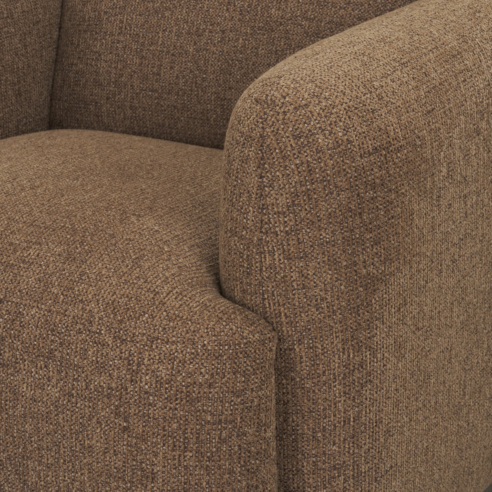 Detail shot of the plush seat cushion and rounded armrest on the Rowan mocha accent chair.