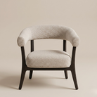 Full front view of the Rowan accent chair featuring oat-colored textured upholstery and a dark espresso wood frame.