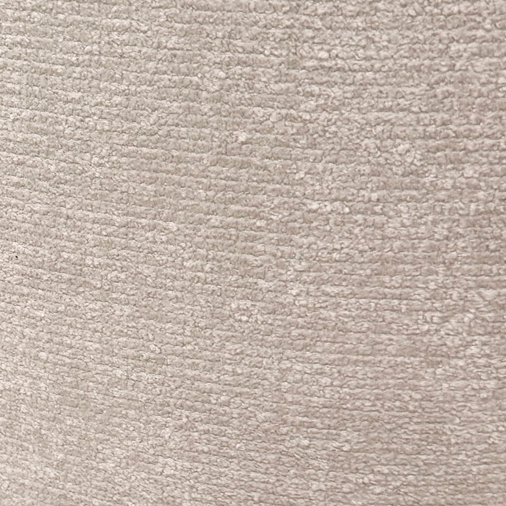 Close-up of a textured oat color chenille fabric surface