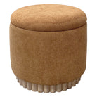 Round brown ottoman with textured surface on a white background