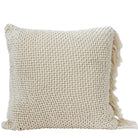 Beige woven pillow with tassels on a light gray background