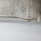 Macro view of the textured woven cushion from the Serenity trio, showcasing the durable fabric and precise edge stitching.