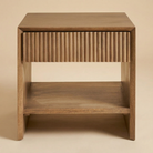 Front studio view of the Silva nightstand featuring solid mango wood construction and a vertically fluted drawer front.