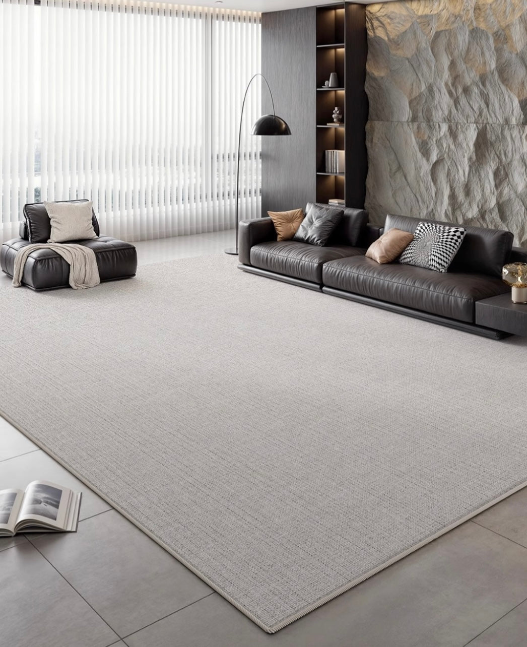 Slate Gray Area Rug styled in a modern living room with leather seating and stone accent wall