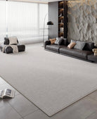 Slate Gray Area Rug styled in a modern living room with leather seating and stone accent wall