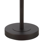 Close-up of the Solenne floor lamp's round painted bronze iron base.