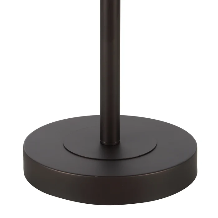 Close-up of the Solenne floor lamp's round painted bronze iron base.