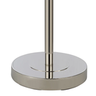 Close-up of the Solenne floor lamp's round polished nickel iron base.