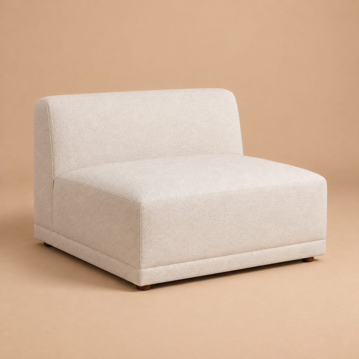 Beige Solis armless piece shown from a three-quarter angle against a solid warm studio background.