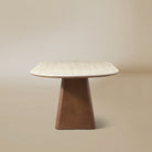 Side view of the Sorella oval dining table with sculptural wood base