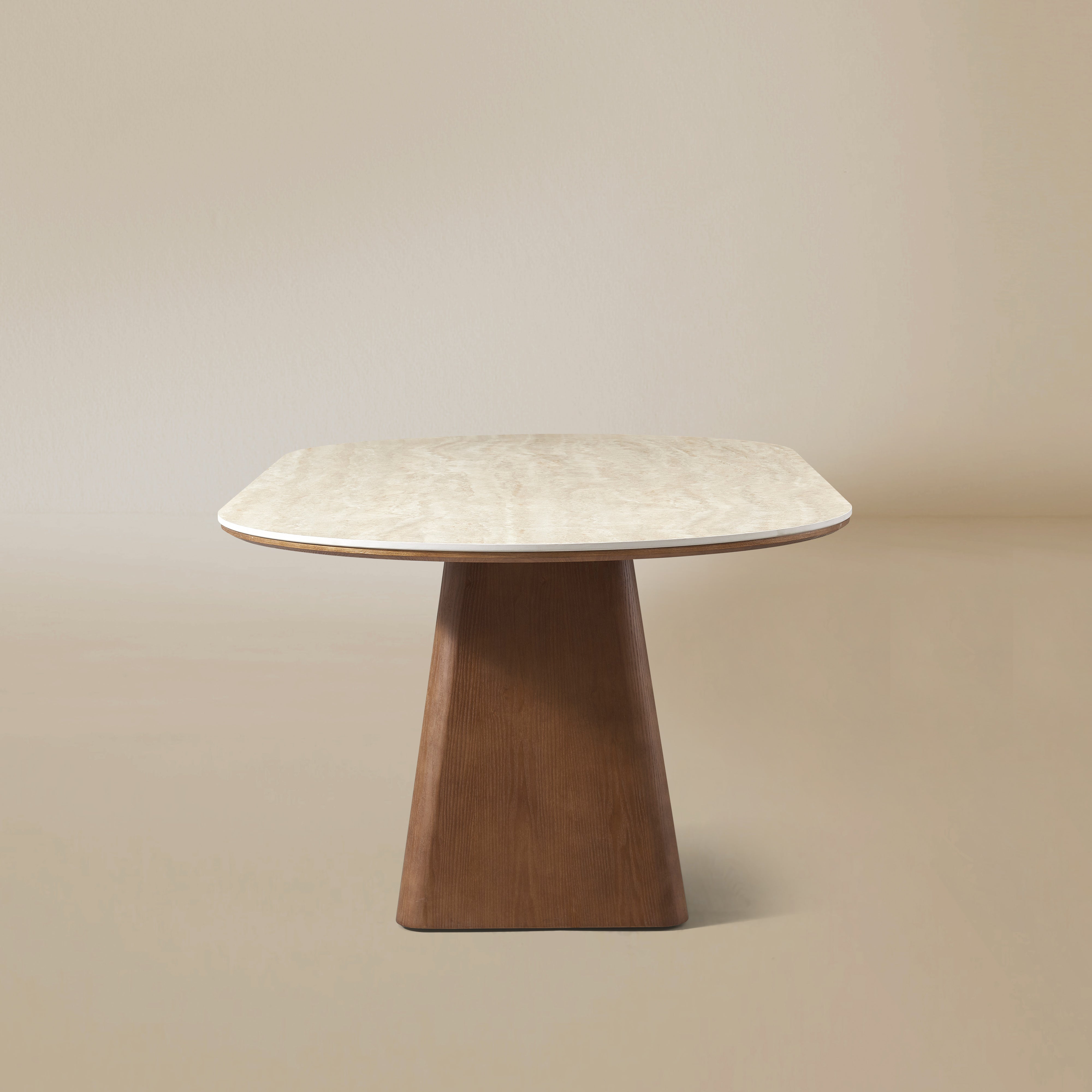 Side view of the Sorella oval dining table with sculptural wood base