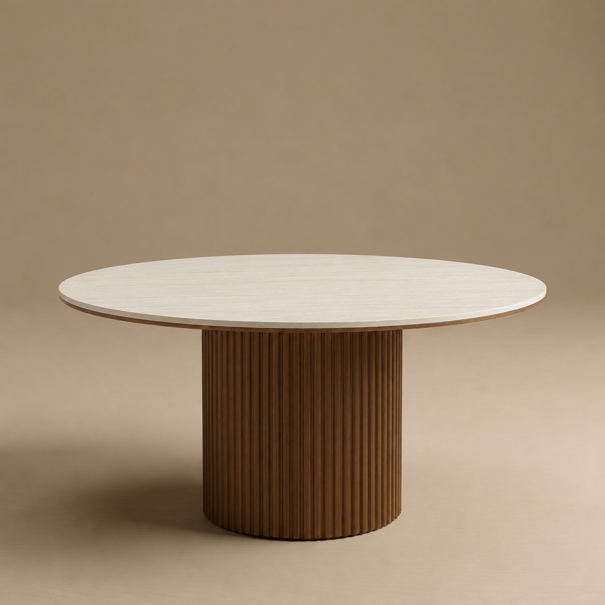 Soren coffee table with a light beige stone top and a fluted brown pedestal base, set against a solid warm beige background.