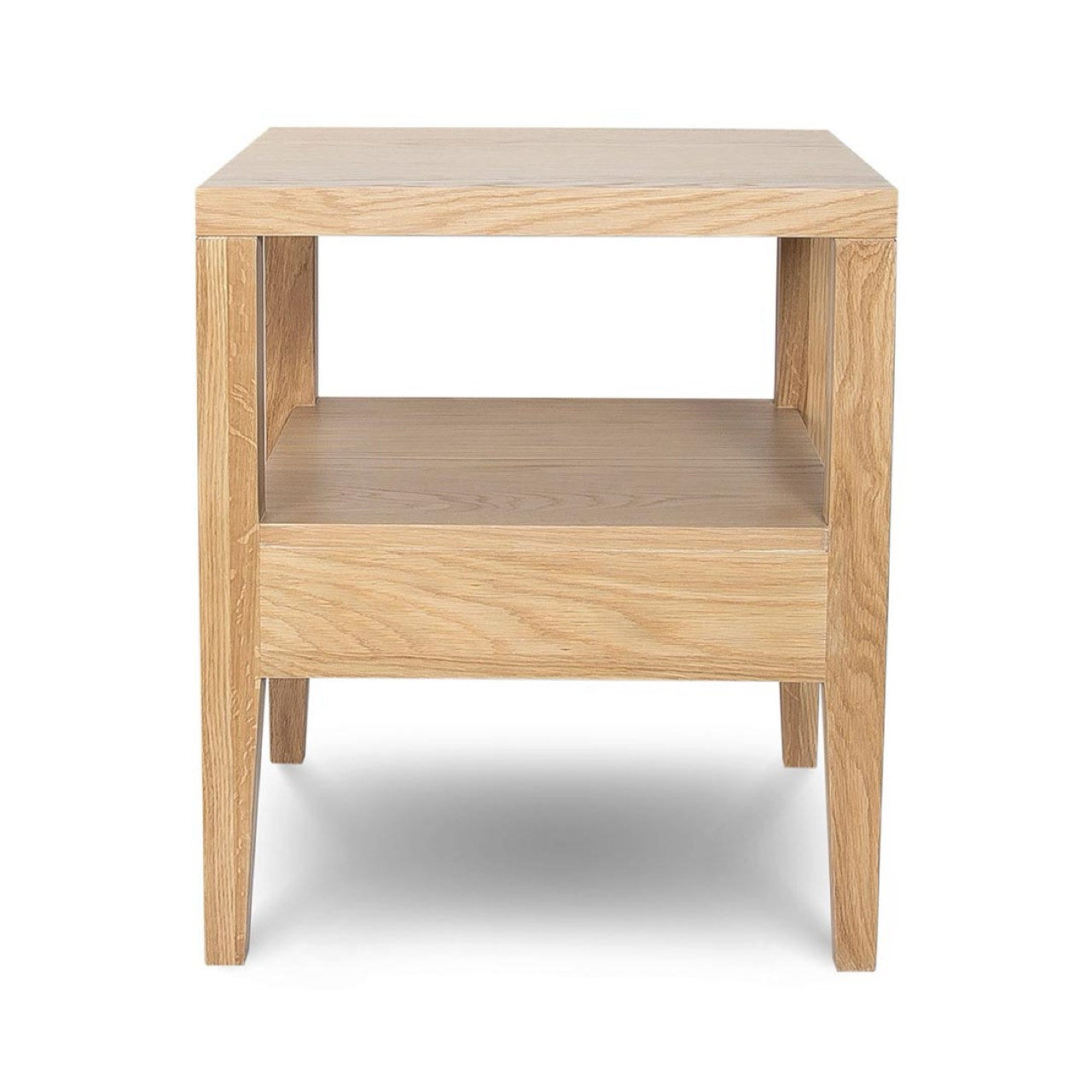 Rear studio view of the Sutton oak nightstand against a white background, showing the open-back cubby design.
