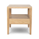 Rear studio view of the Sutton oak nightstand against a white background, showing the open-back cubby design.