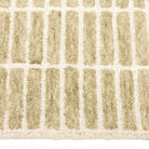 Close-up of the Tessera Hand-Tufted Wool Grid Rug in sage showing its soft wool pile and ivory grid lines.