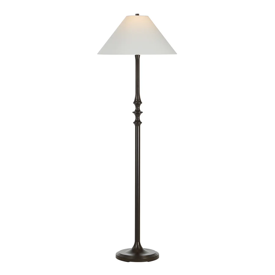 Thalia Dark Bronze Floor Lamp illuminated to show the warm glow through its off-white linen shade.