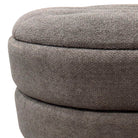 Close-up of a textured gray ottoman on a white background