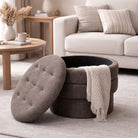 Round storage ottoman with a tufted lid in a living room setting.