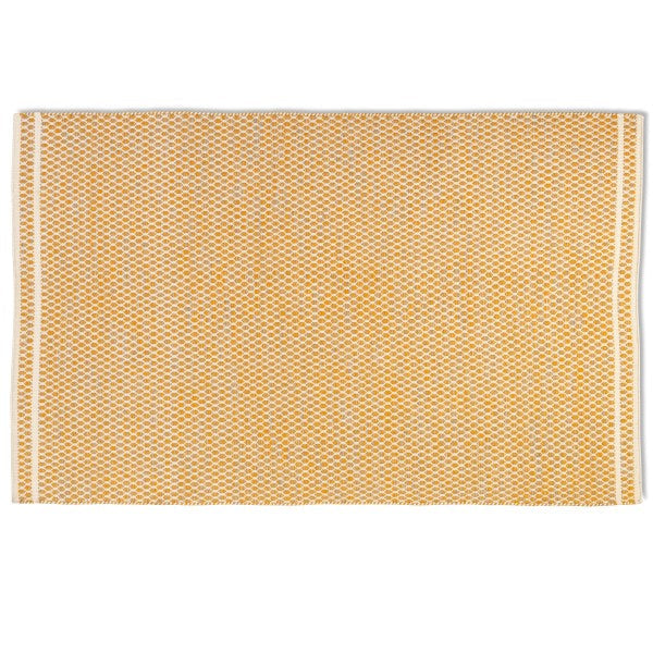 Full overhead view of the rectangular Theo hand-woven wool rug in mustard yellow and cream with a geometric design