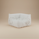 TOGO Lounger corner seat unit in white fabric featuring pleated design for modular sectional configuration.