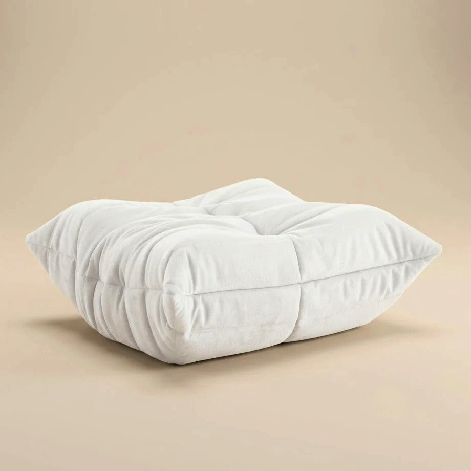 White ottoman on a beige background