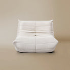 Front view of the TOGO Lounger in matte white in studio background