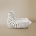 Side view of the TOGO Lounger in matte white in studio background