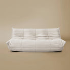Front view of the TOGO Three Seater Lounger in a light beige studio background