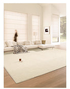 Angled view of the Tranquil Ivory Carpet in a modern living room with warm wood flooring