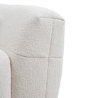 Close-up of the boucle fabric of the cream Gummy Sofa on a white background