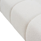 Close-up of a textured boucle fabric on a white background