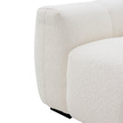 Macro close-up of the Gummy sofa highlighting the deep vertical tufting and the rich texture of the cream bouclé.