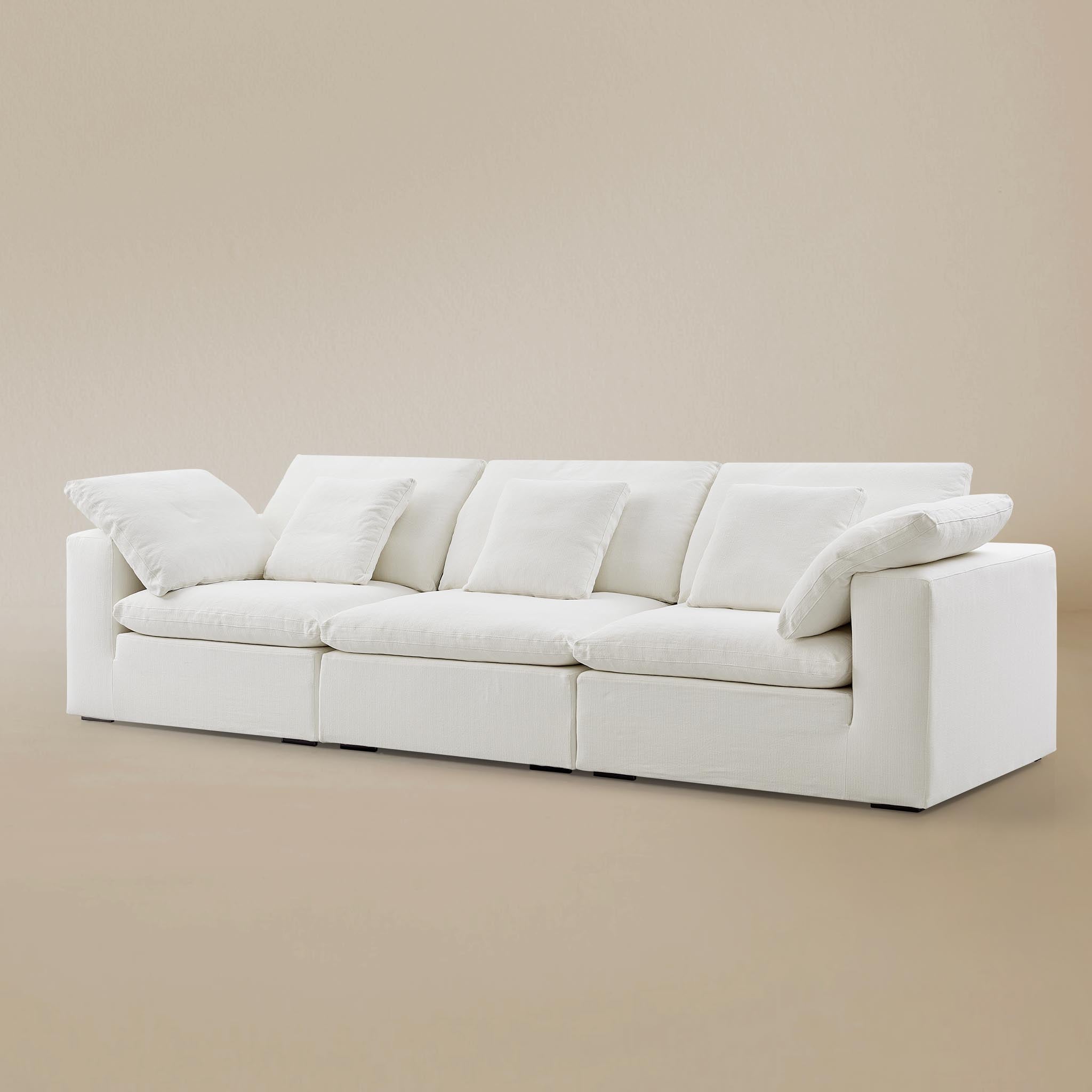 Ultra softness modular sofa three seater on a beige studio  background