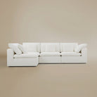 Front view of the Cloud sectional sofa on a beige studio background.