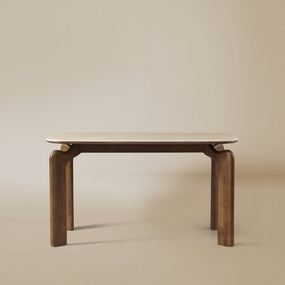 Front view of Valencia dining table with sintered stone top and curved solid wood legs on beige studio background