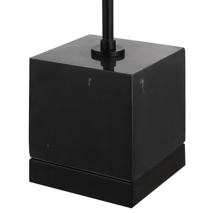 Black cube-shaped lamp base on a white background