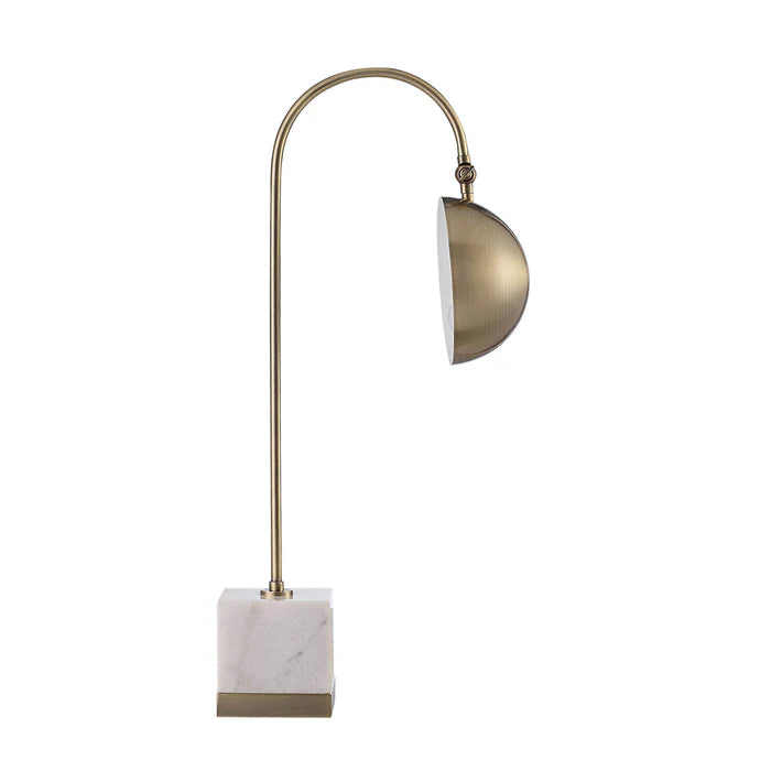 Decorative lamp with brass arch and marble base on a white background