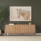 Varelle Carved Mango Wood Sideboard styled in a warm contemporary room beneath framed horse artwork.