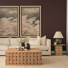 Lifestyle detail of the Varelle Square Side Table showing the carved pedestal base styled with a lamp and greenery.